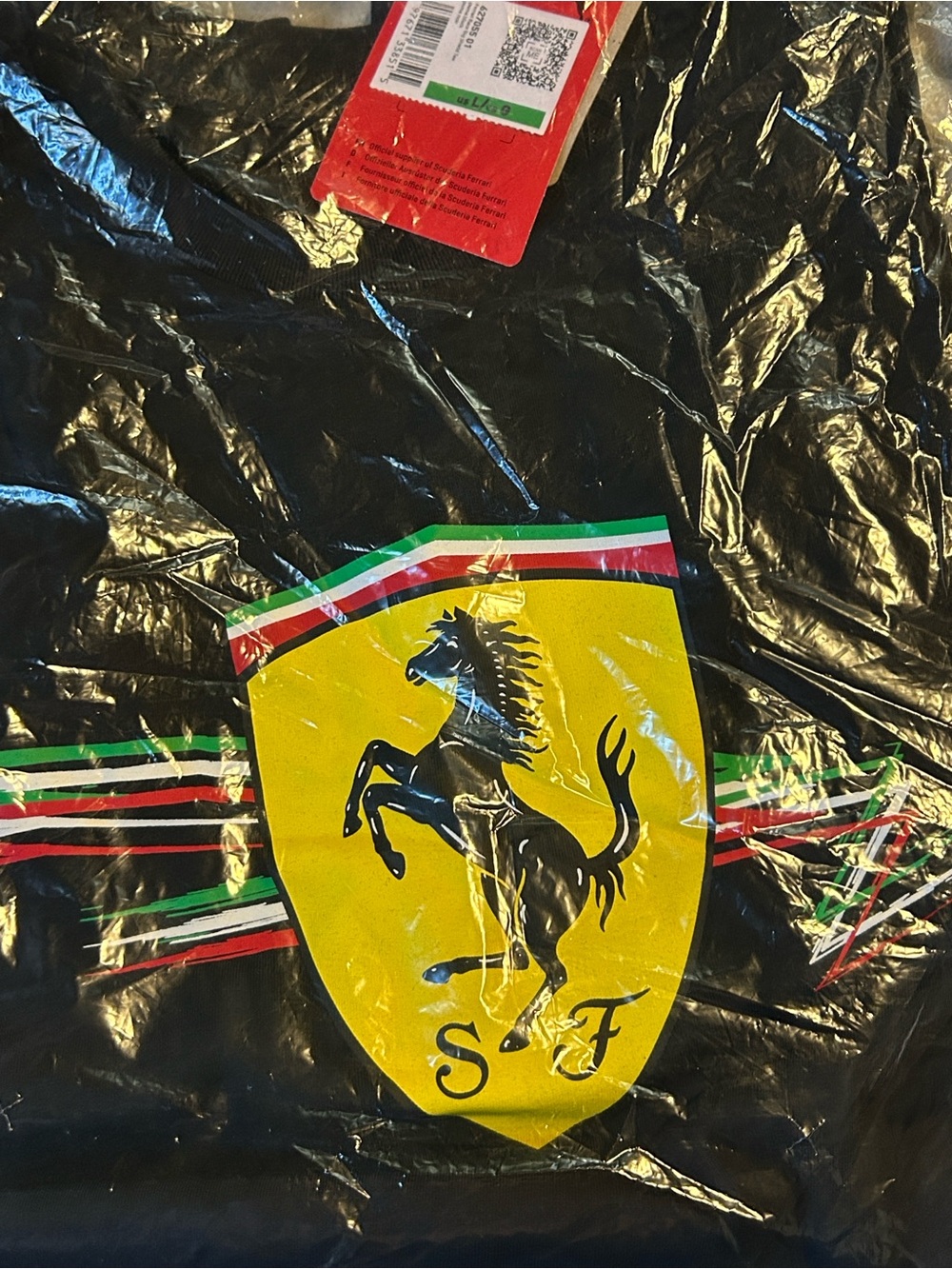 Puma Black Short Sleeve Tee with Yellow Shield Logo and Tricolor Stripes